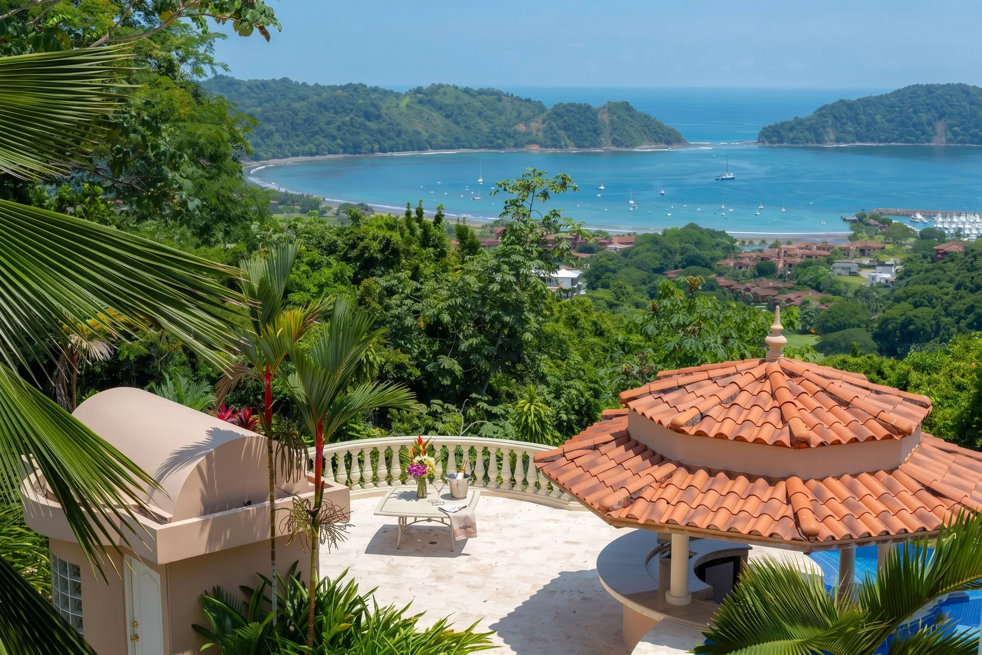 Casa Garmus terrace above Los Sueños in Playa Herradura, Costa Rica, overlooking the marina bay and Pacific coastline.
